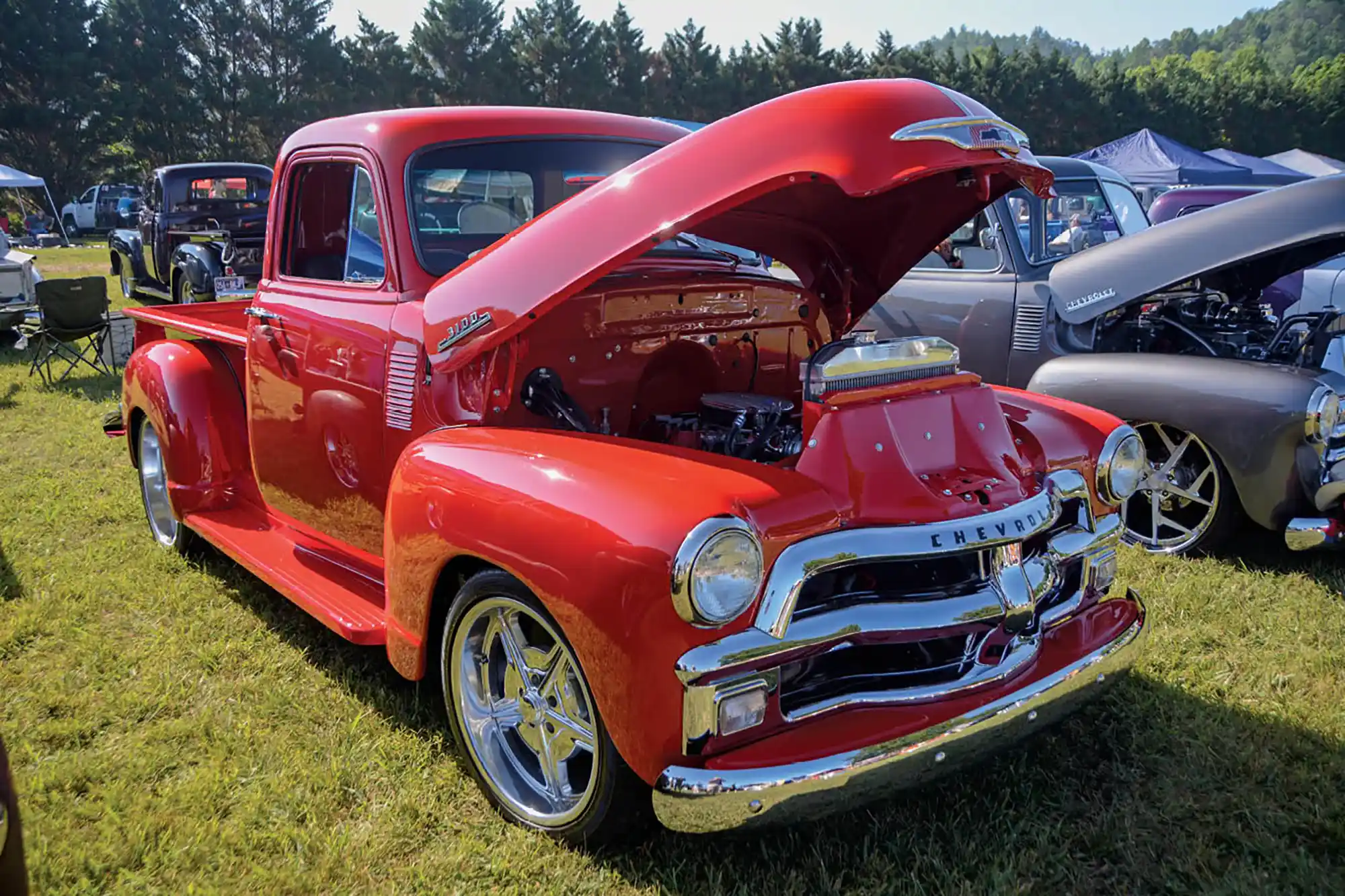 red Chevy truck with hood propped open