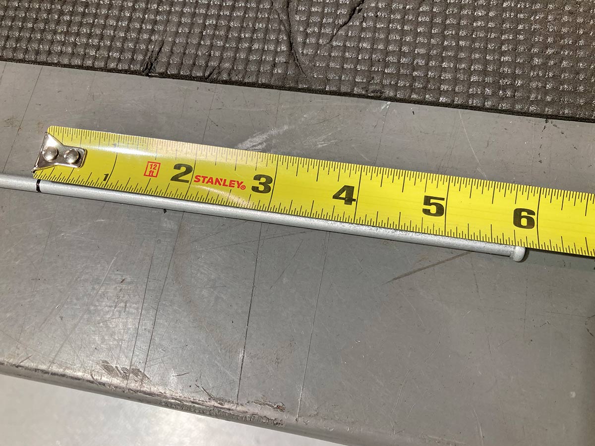 yellow measuring tape measuring brake line