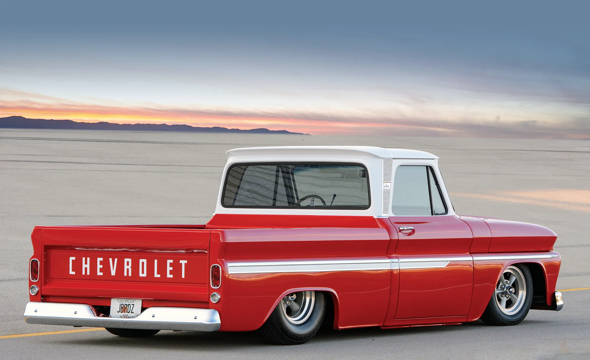 red and white '66 Chevy C10 3/4 view from rear