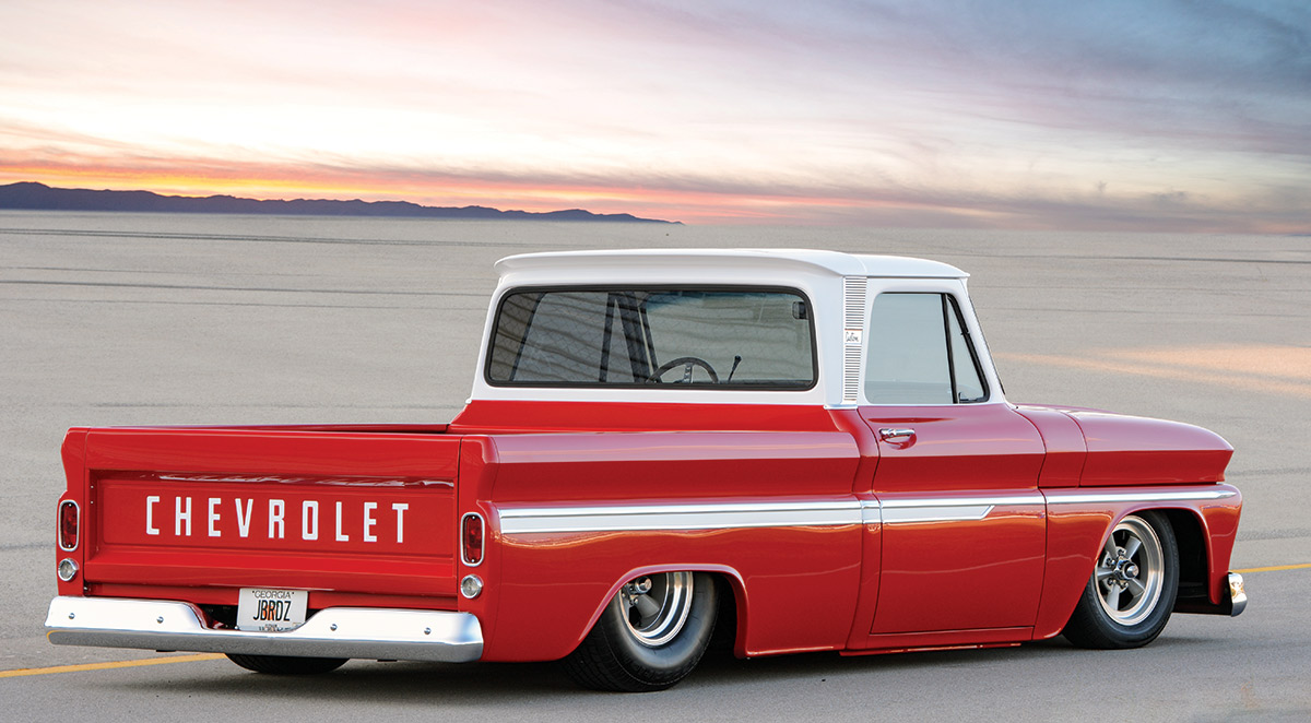 3/4 rear view of a red and white '66 Chevy C10