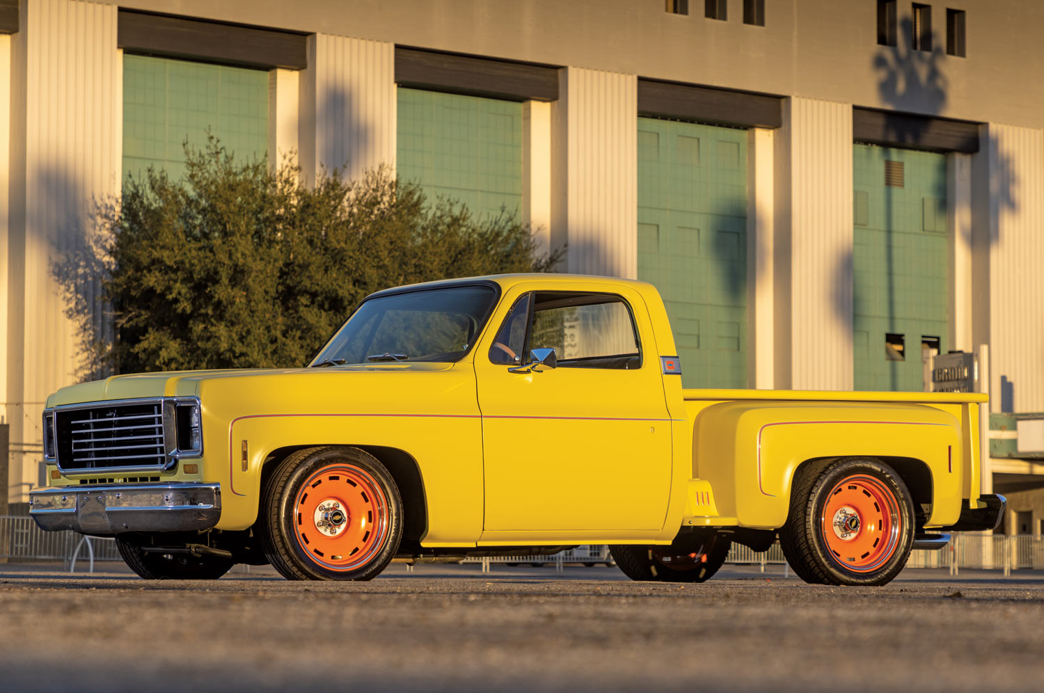 side view of yellow chevy ’74 Stepside Squarebody pickup truck