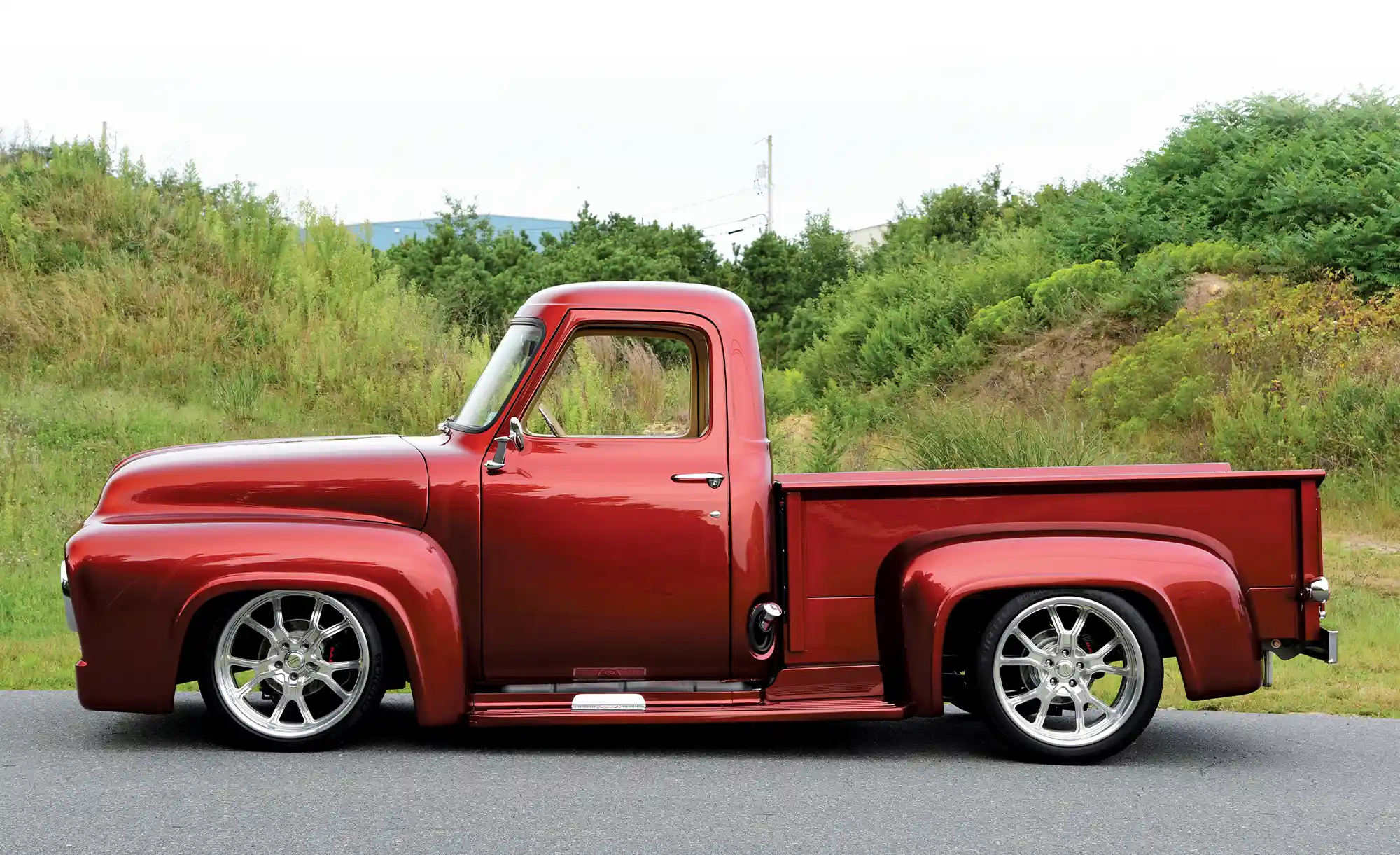 side view of a red '53 Ford F-100