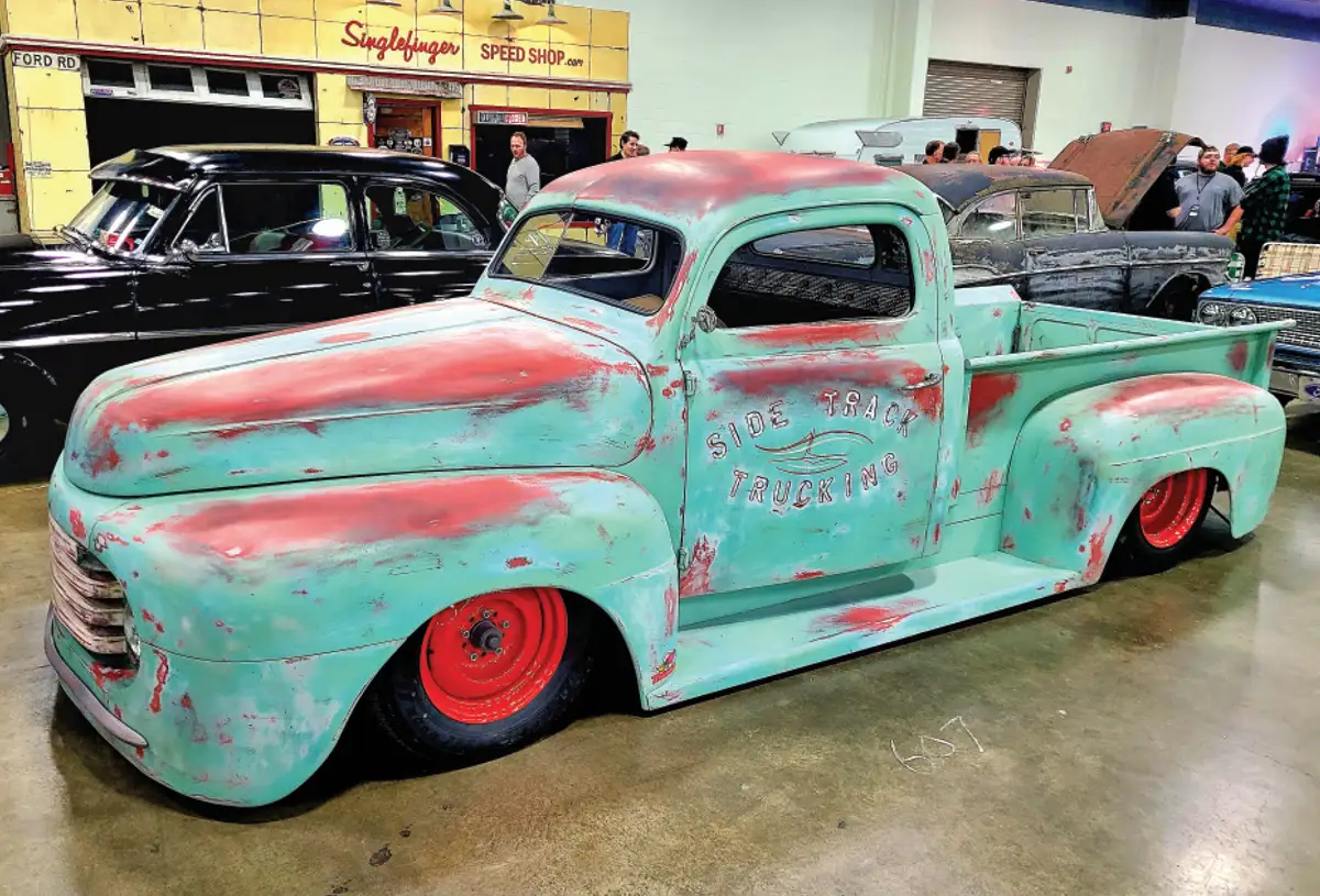 driver side quarter view of a copper patina classic truck
