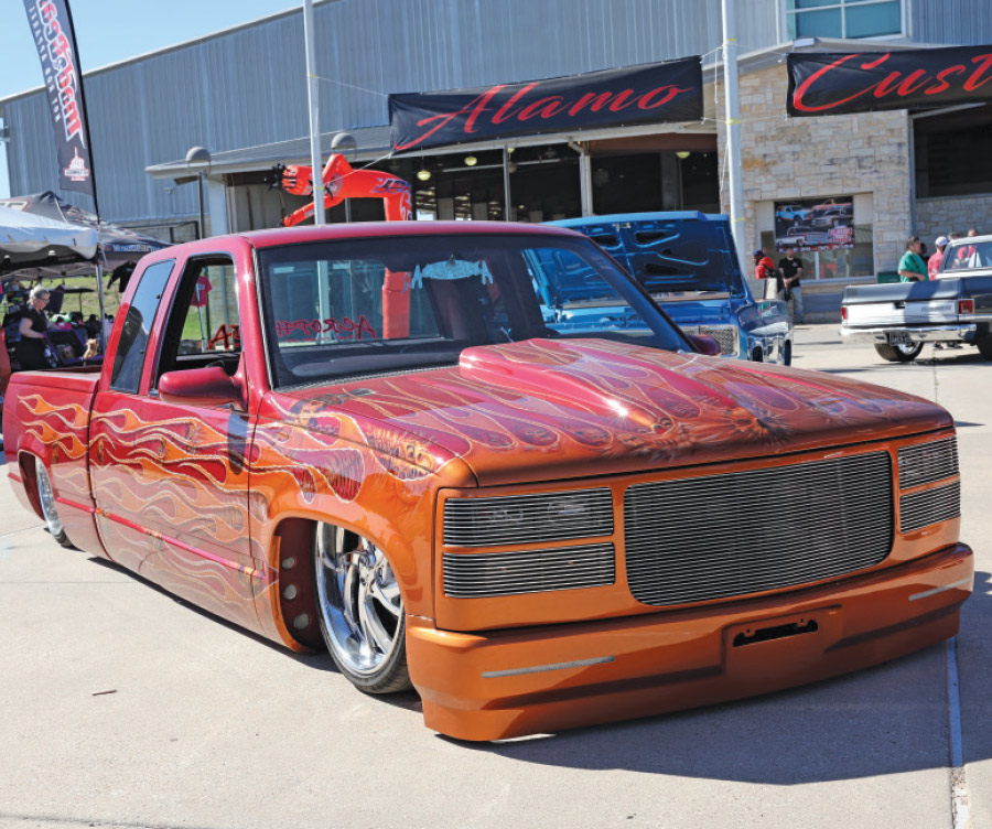 orange low rise truck with flames