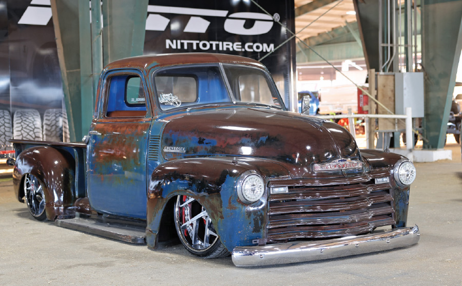 blue low rise truck with brown rust