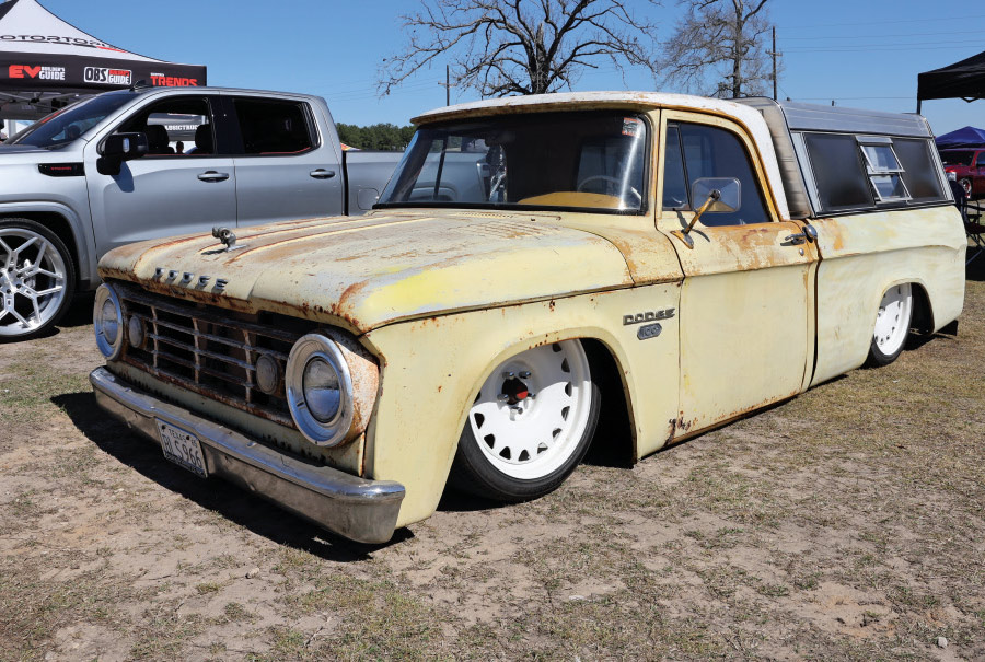 front view of cream low rise truck with rust