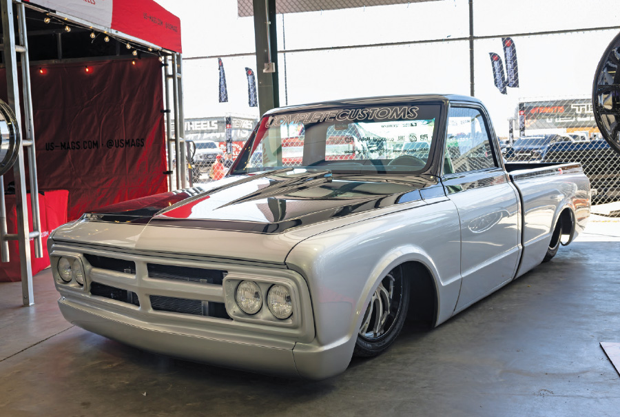 silver truck with black stripe on hood