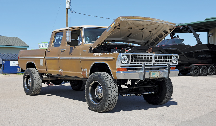 light brown truck with hood open