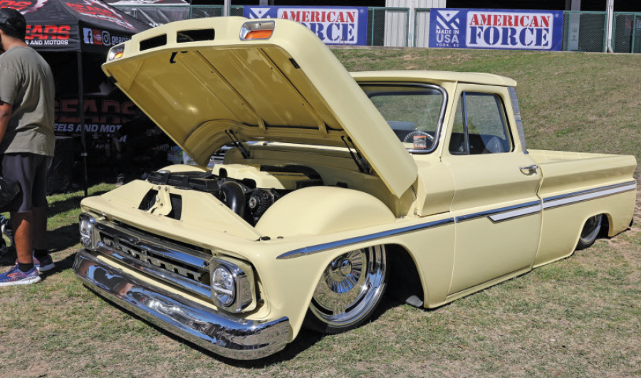 yellow low rise truck with hood open