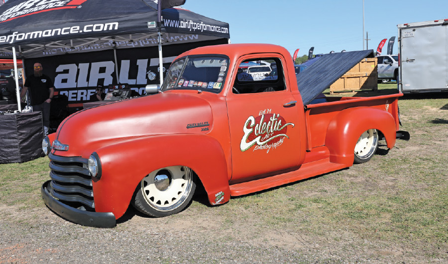 red orange truck with Eclectic logo decal