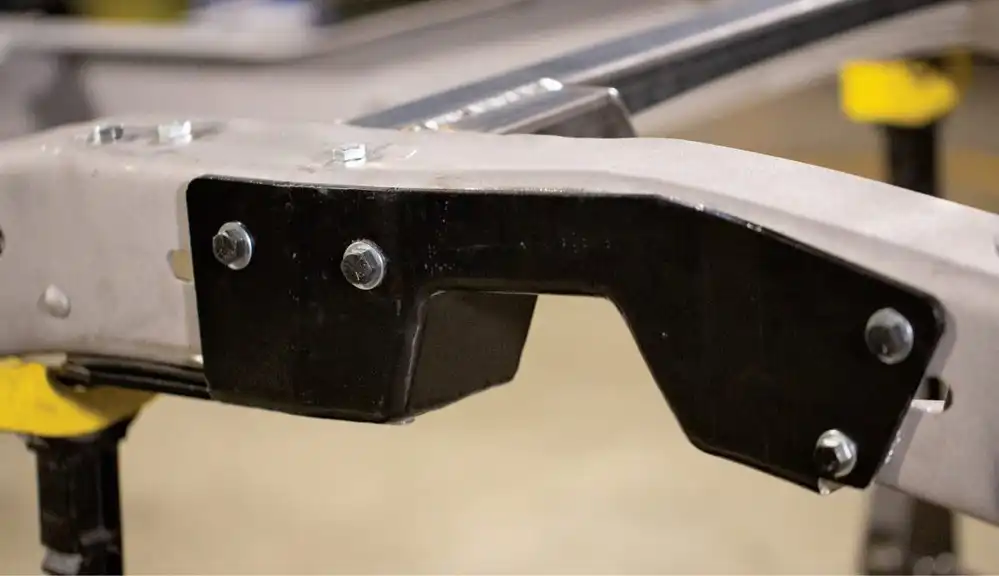Before the frame was covered in fresh paint, we installed some Speedway Motors bolt-in rear C-notches to make sure we would have plenty of suspension travel with the lowered stance we had planned.