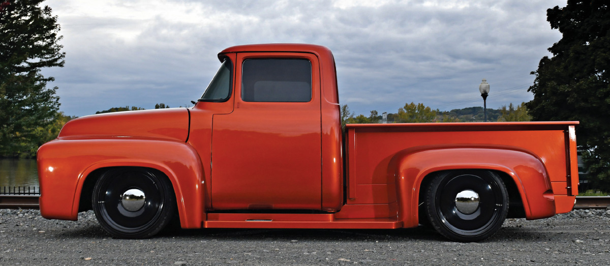 side profile of red orange ’56 Ford F-100
