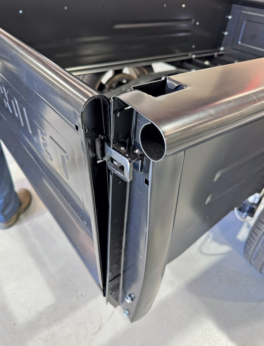 closeup of rudimentary bolts installed on tailgate