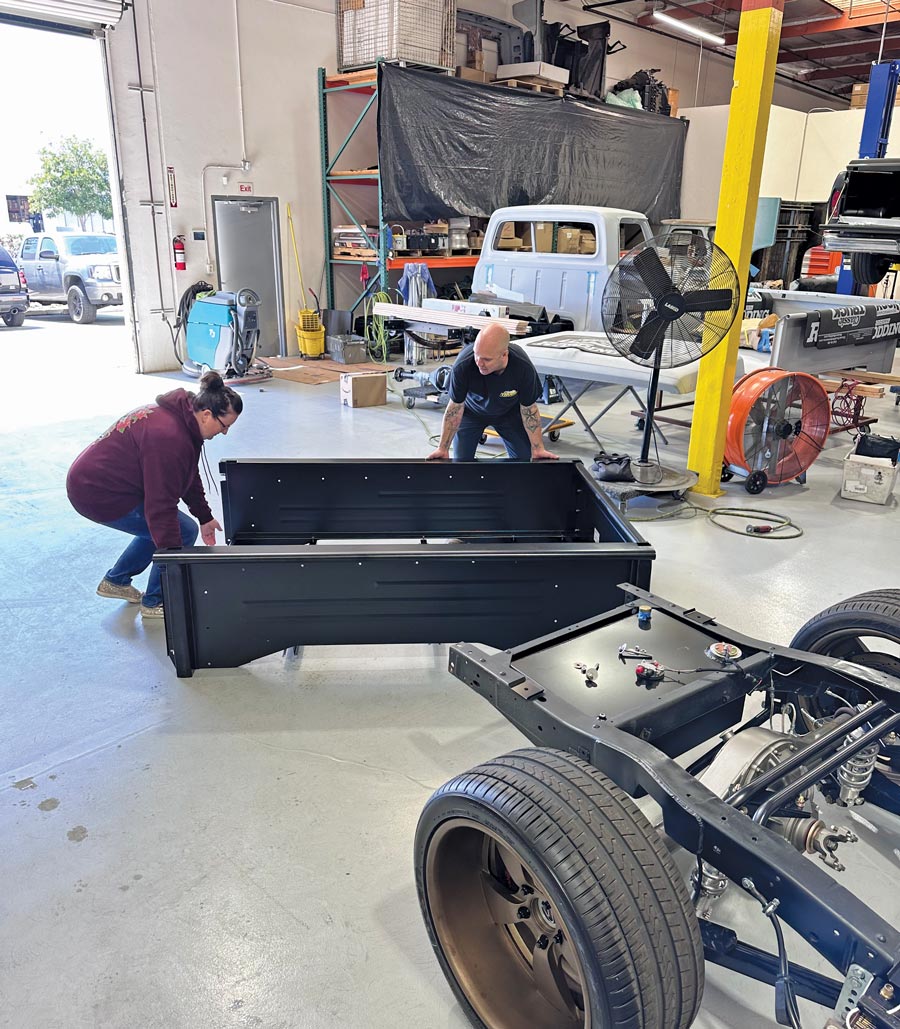 man and woman moving truck bed together