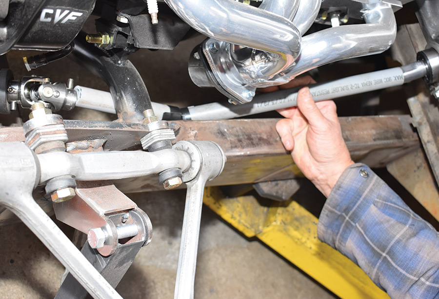 pieces of PVC pipe taped together to mock up the steering shafts and U-joints from the column to the rack-and-pinion