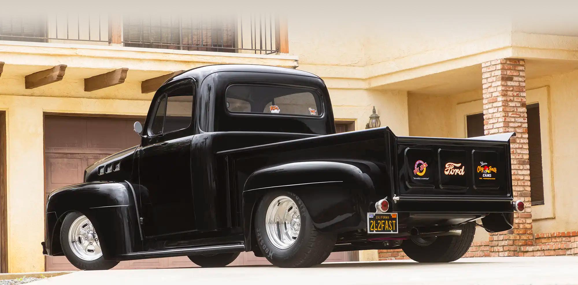 3/4 rear view of black '51 Ford