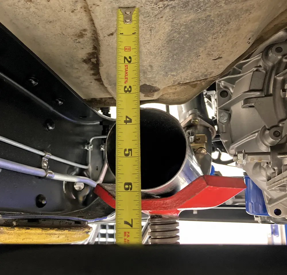 tape measuring a pipe end vertically