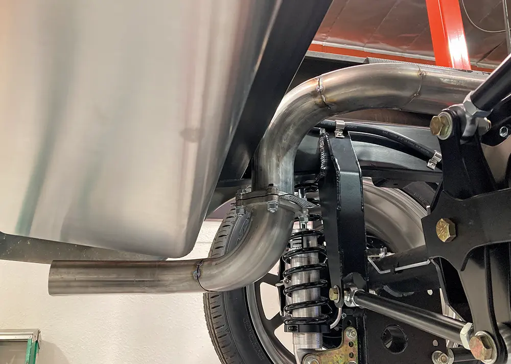 a pair of flanges on each side ensure easy removal of the entire exhaust system if need be