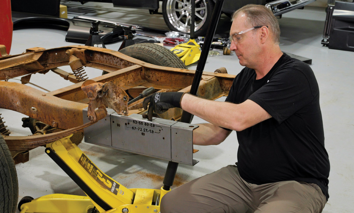 Danny Nix positioning the template that will serve as a guide to cut a longbed GM frame down to shortbed size