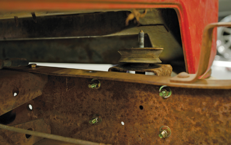 the back of the cab supported with a floor jack