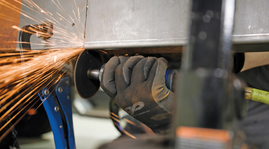 abrasive wheel being used to cut the slot in the template as a guide