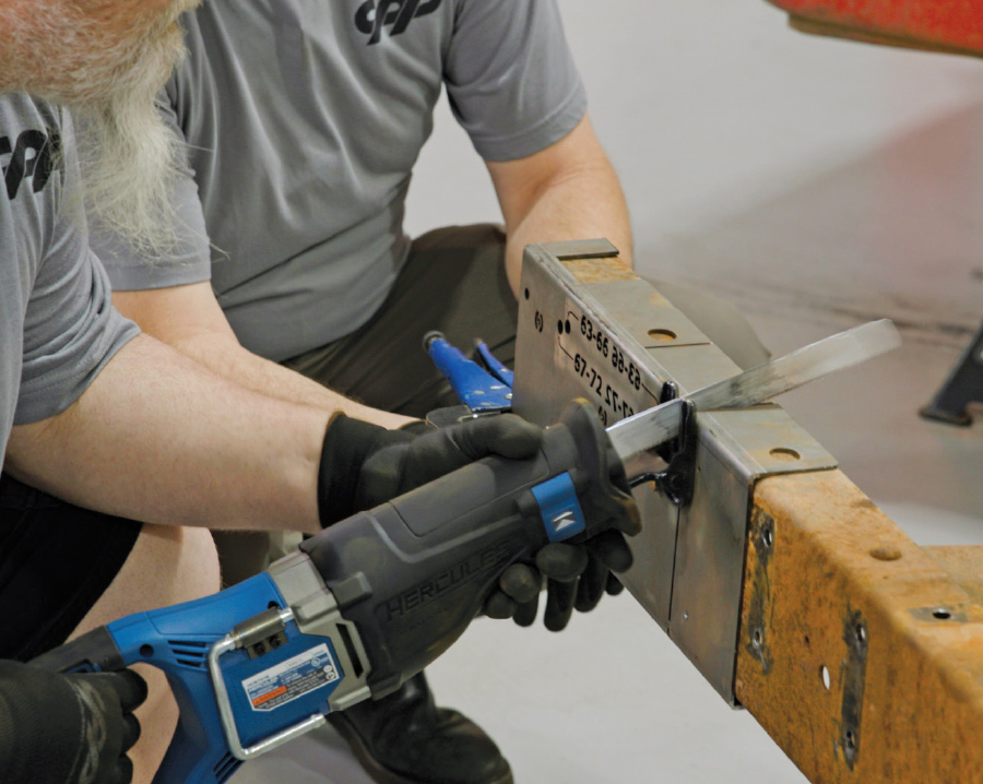 reciprocating saw being used to make the final cuts on the rear portion of the framerails