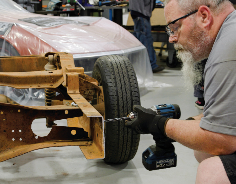 1/8-inch pilot holes being drilled to 3/8 inch