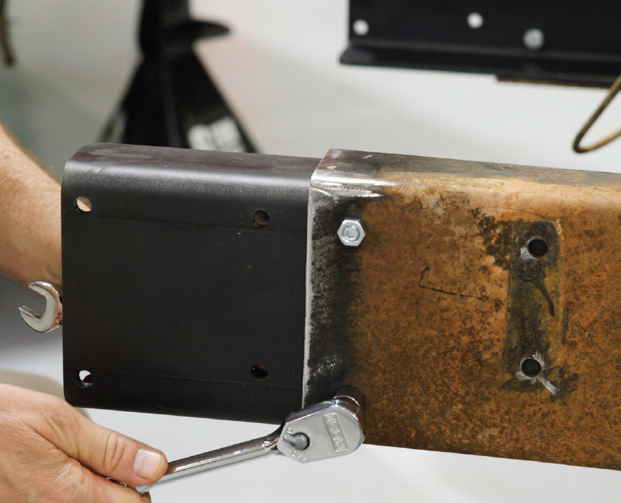 the supplied hardware the reinforcements being bolted to the rear section of the frame