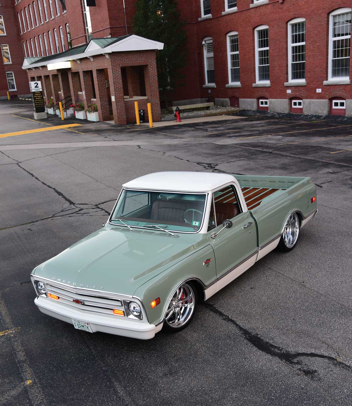 Overhead view of a 1968 Chevrolet C10 custom truck in a pale green and white two-tone paint scheme