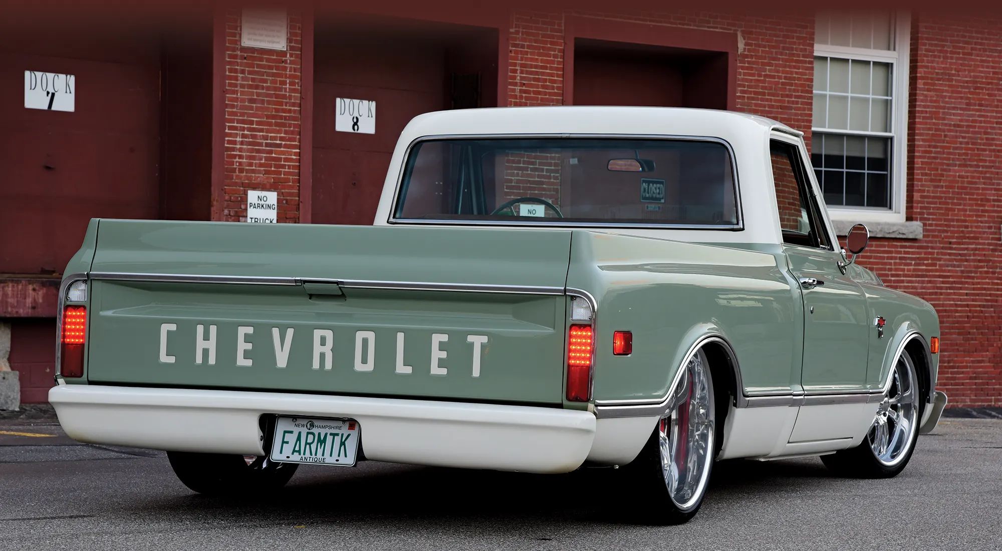 Rear view of a 1968 Chevrolet C10 with a custom tailgate and FARMTK license plate
