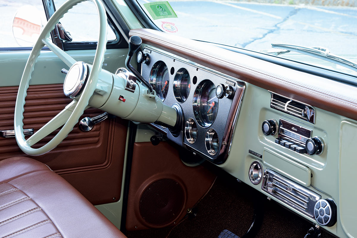 Interior of a 1968 Chevrolet C10 featuring a mint green and brown dashboard