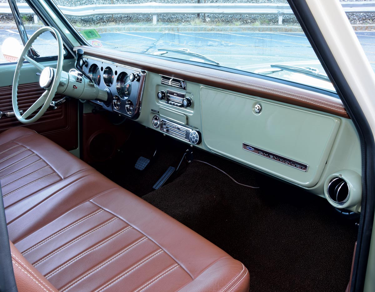 Full view of the mint green and brown interior of a 1968 Chevrolet C10 truck