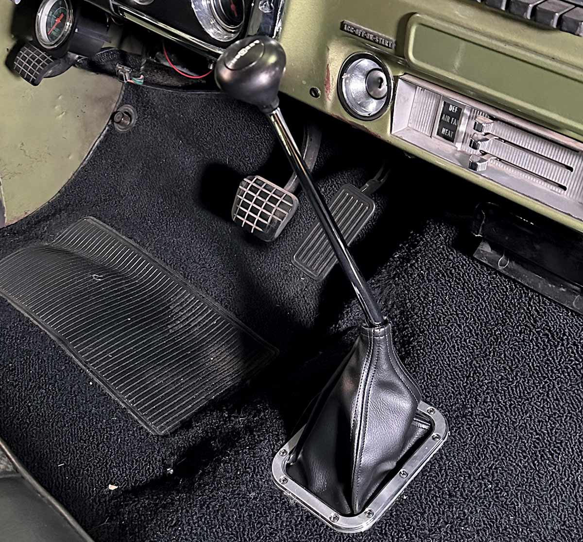 Interior view showing manual gear shifter and dash of a 1967-1972 Chevrolet C10