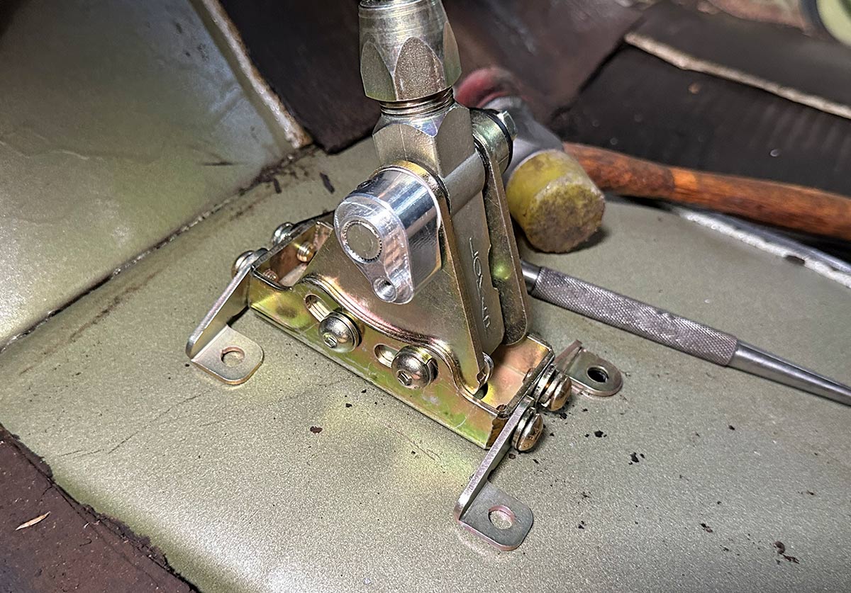 Lokar shifter mechanism being installed into the trucks floor