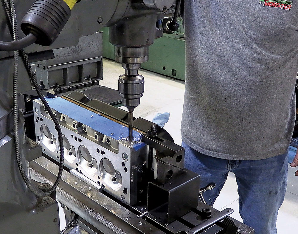 Precision drilling of a cylinder head on a milling machine for accurate component installation