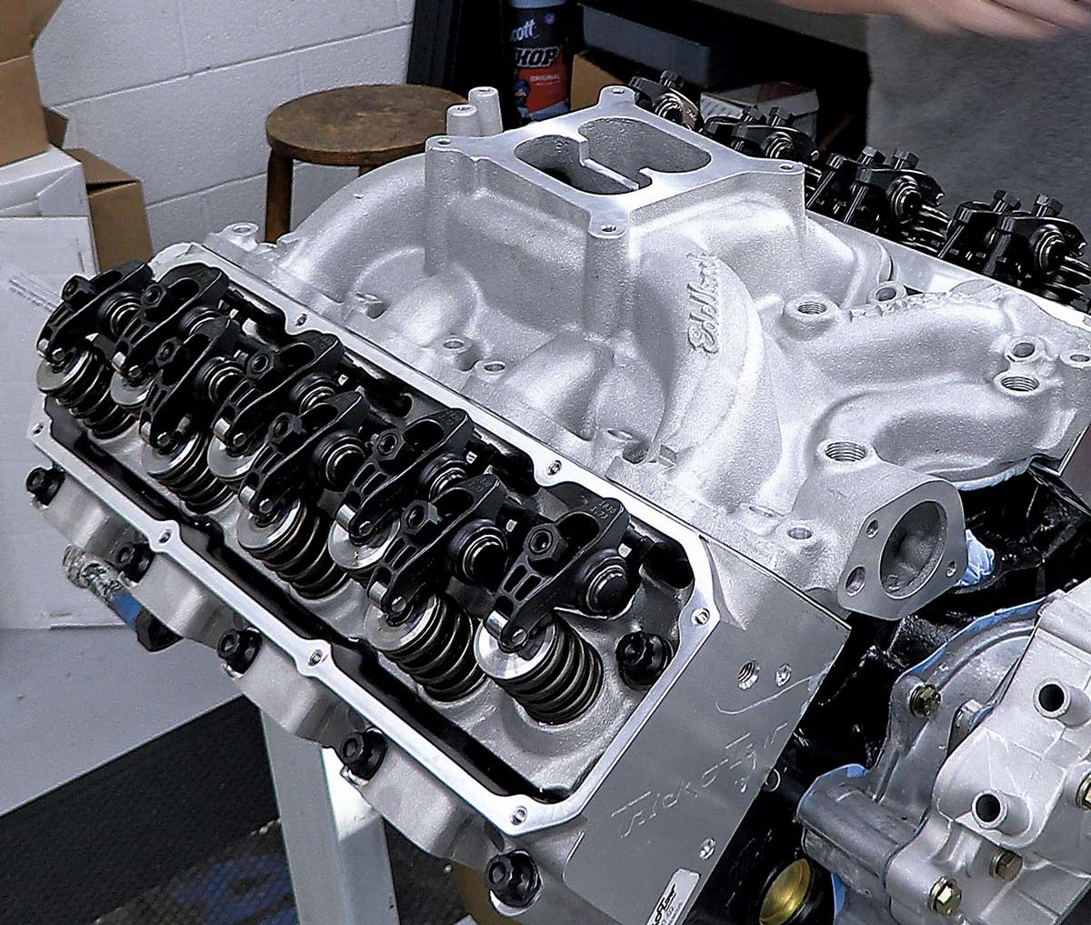 Assembled engine with Trick Flow and Edelbrock components, nearing completion in the workshop
