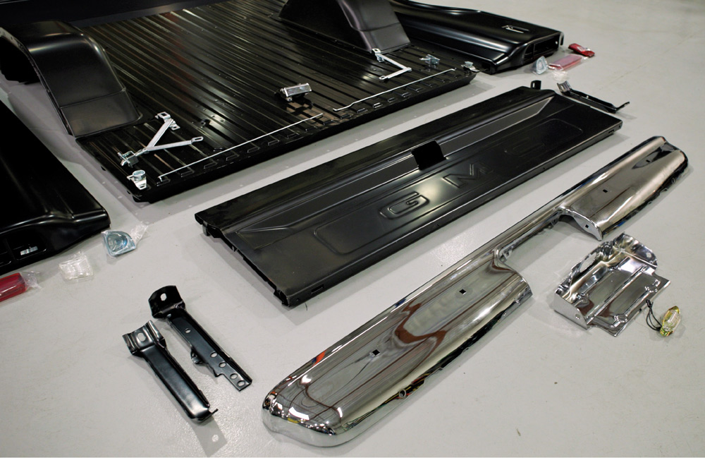 New chrome bumper and bed components laid out for a 1967-1972 GMC truck restoration