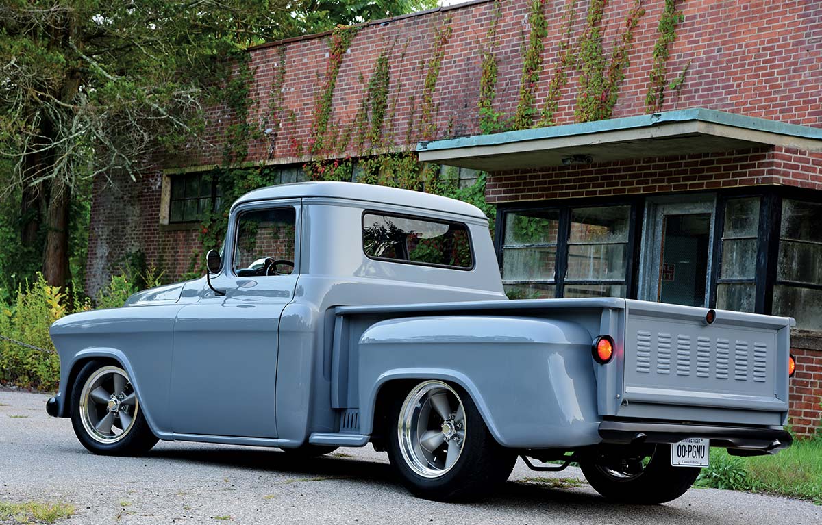 Rear three-quarter view of the 1957 Chevrolet 3100, featuring custom taillights and a modified tailgate