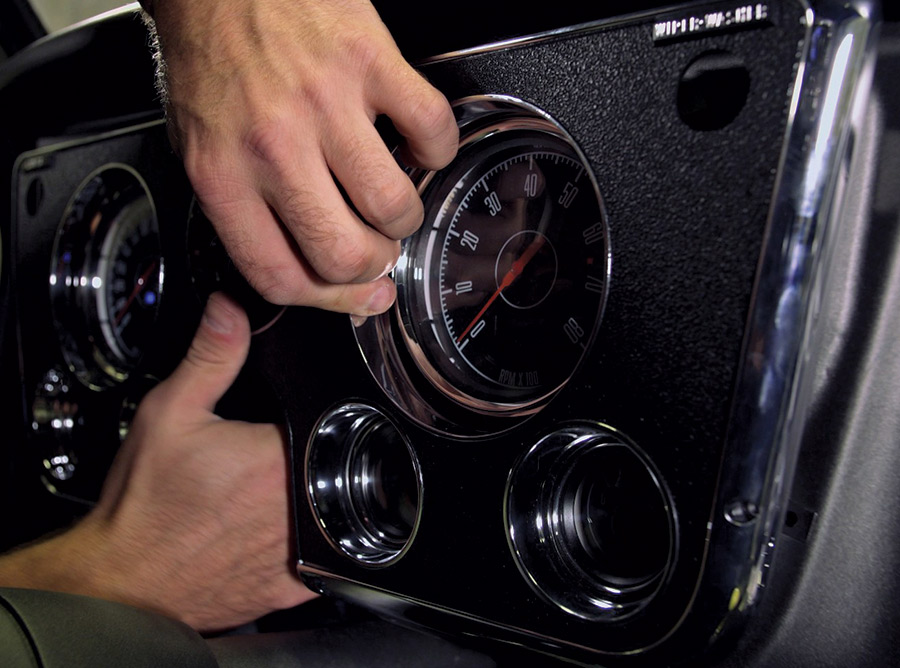 Custom gauge cluster being fitted and wired into dash 1968 C10