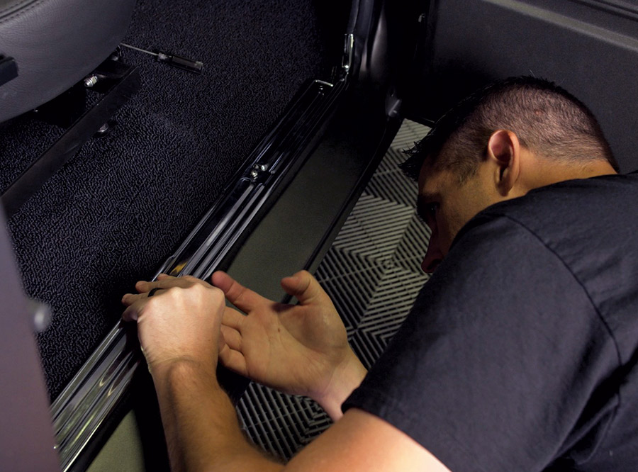 Installing new sidesteps on the cab of 1968 C10