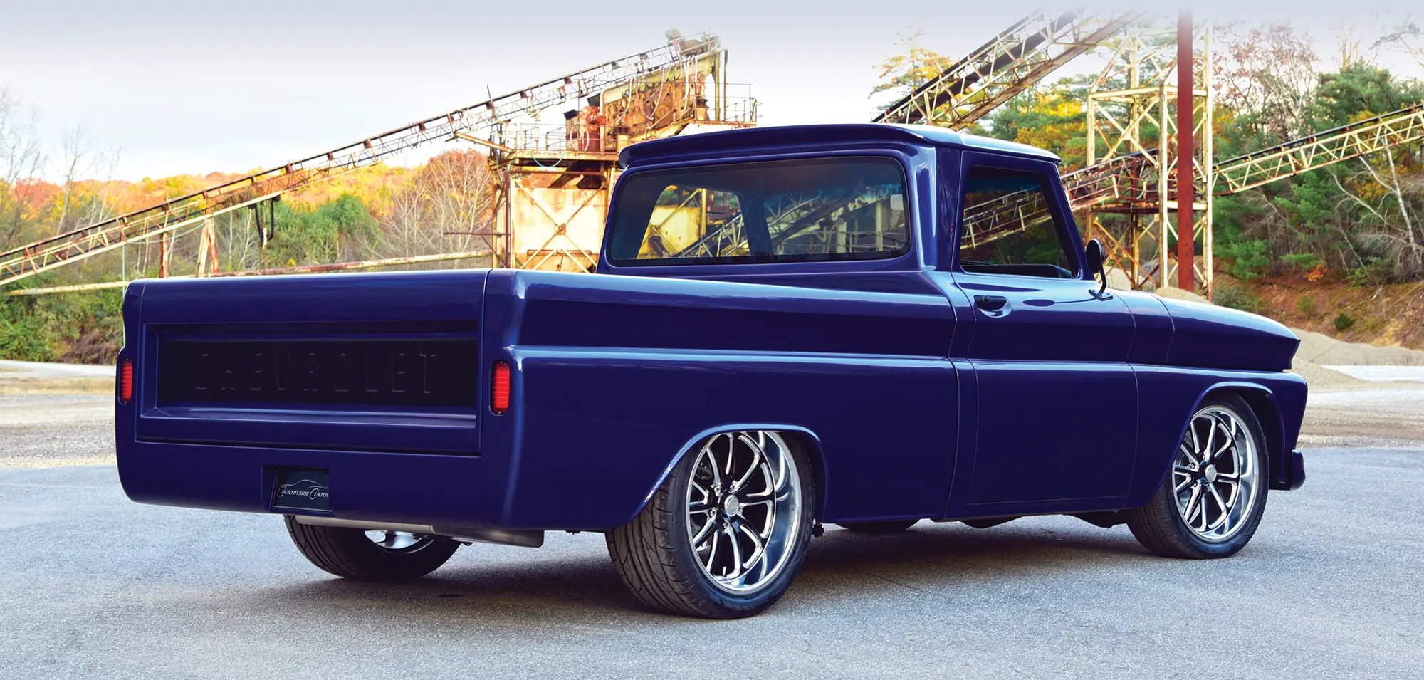 Rear view of the 1966 Chevrolet C10, featuring a clean tailgate design and custom exhaust setup