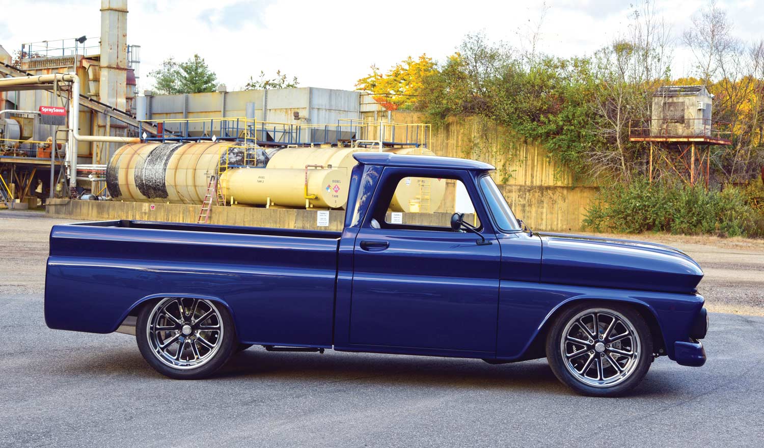 Side profile of the 1966 Chevrolet C10, highlighting its smooth lines and aftermarket chrome wheels