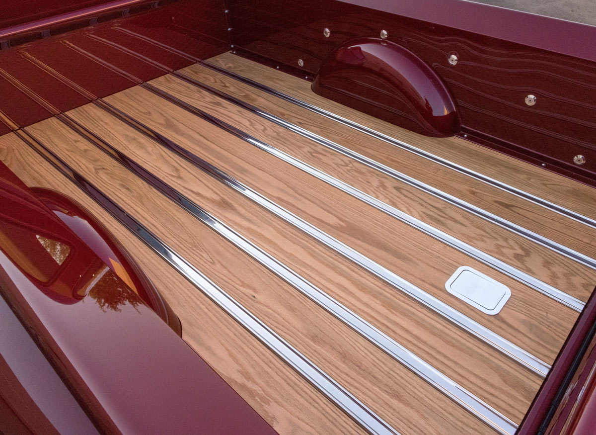 Wood bed with chrome strips in the rear of a custom 1952 Chevrolet 3100