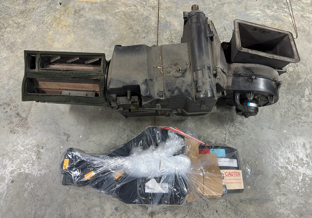 Comparing the old air conditioning unit with the new replacement for a 1990s Chevrolet CK 1500