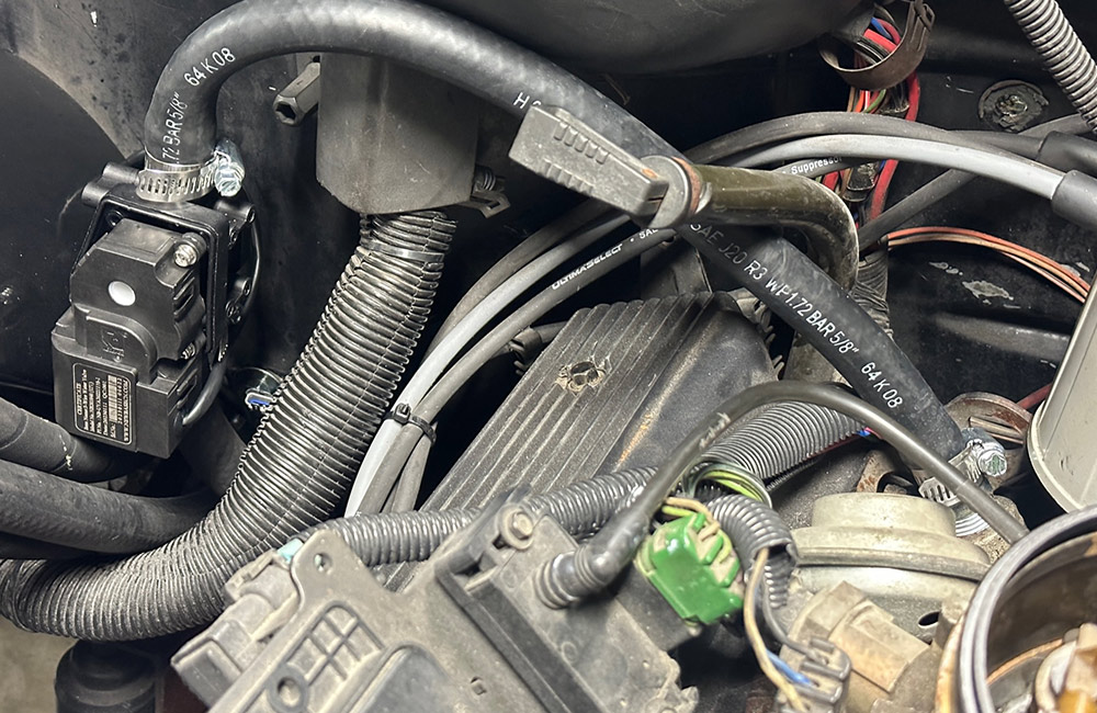 Securing an AC valve and hose connection inside a 1990s Chevrolet CK 1500