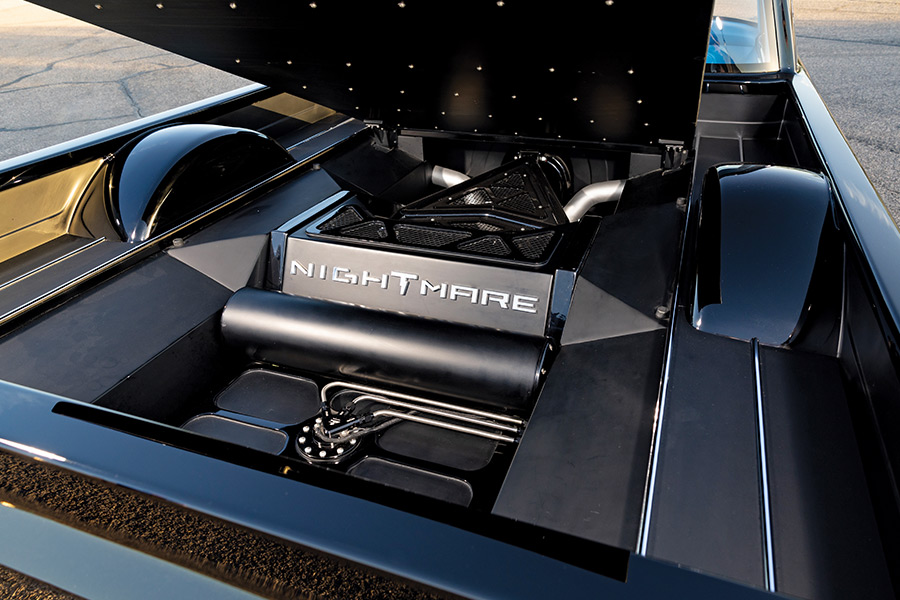 Hidden compartment labeled Nightmare in a custom 1961 Ford F100 truck bed