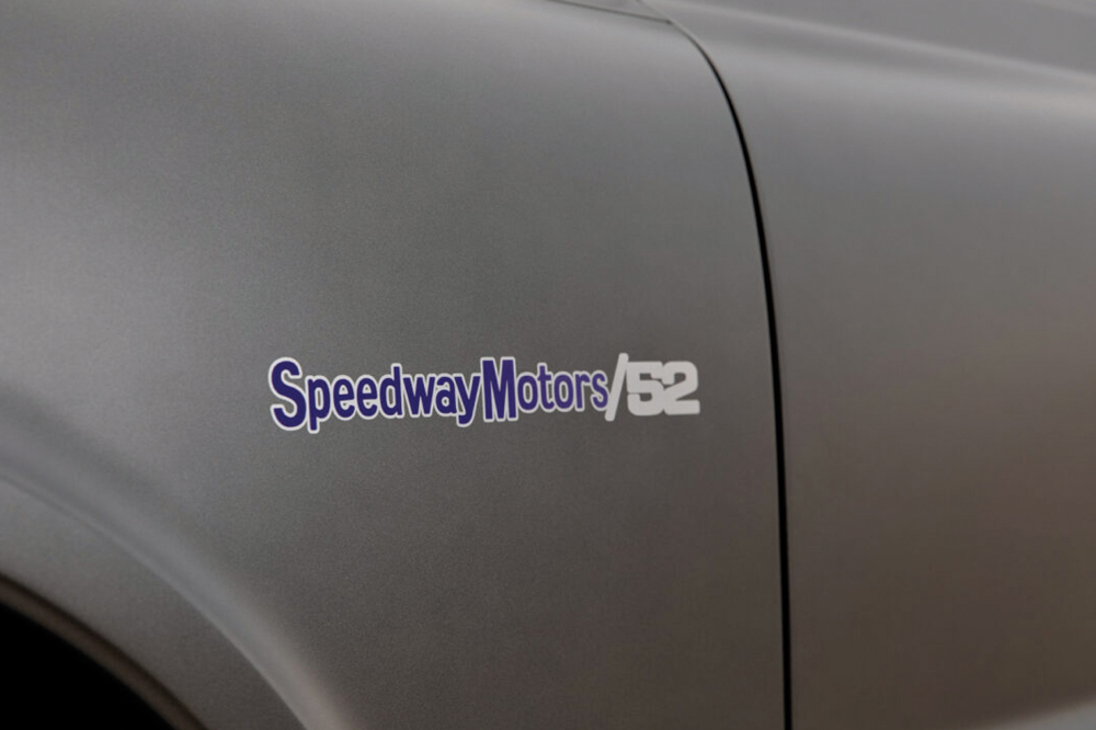 A close-up of the Speedway Motors emblem on the 1968 Chevrolet C10's fender, highlighting the custom build