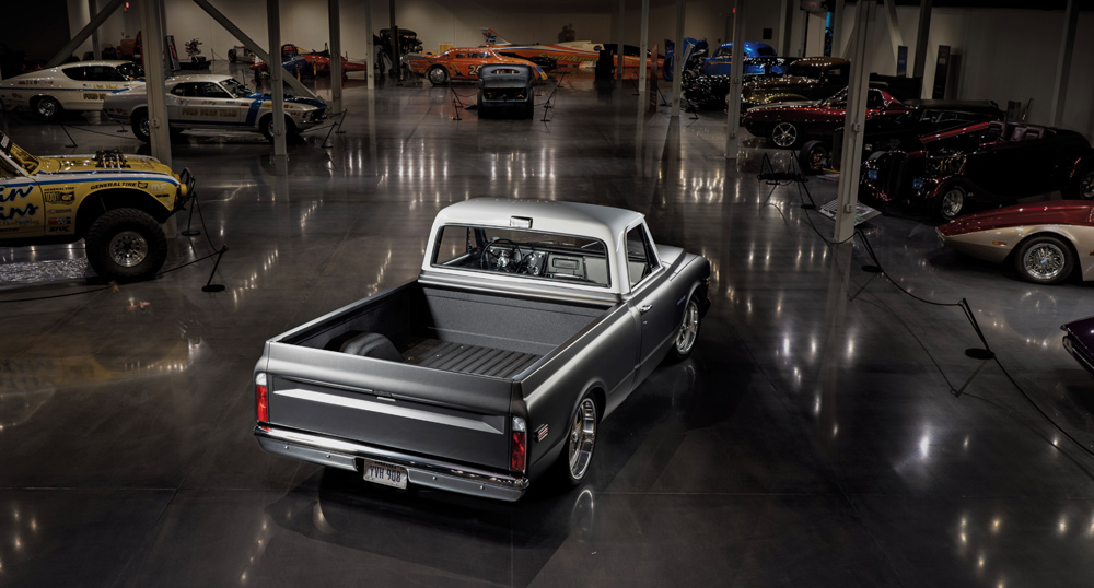 Speedway Motors 1968 Chevrolet C10 on display, surrounded by classic cars in a museum setting