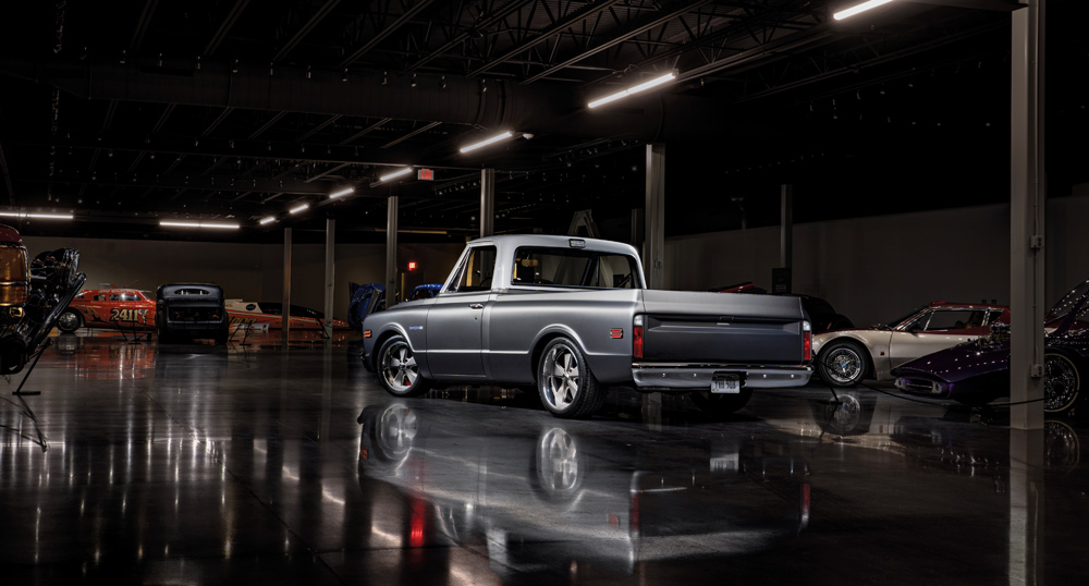 Rear view of 1968 Chevrolet C10 showing custom bed liner and museum backdrop