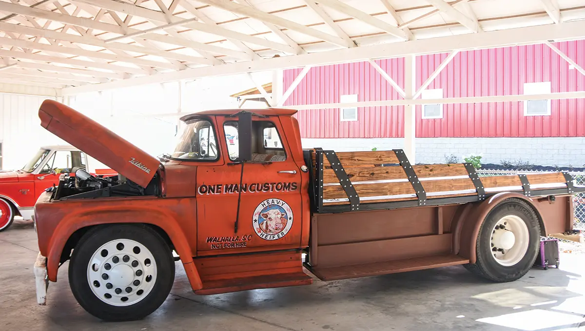 heavily modified 1958 Chevrolet Viking with custom wooden side rails and a weathered patina finish